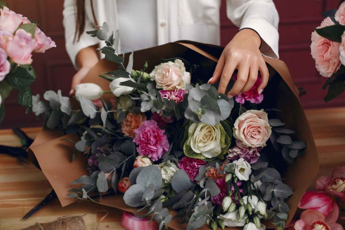 A florist with a beautiful flower bouquets.