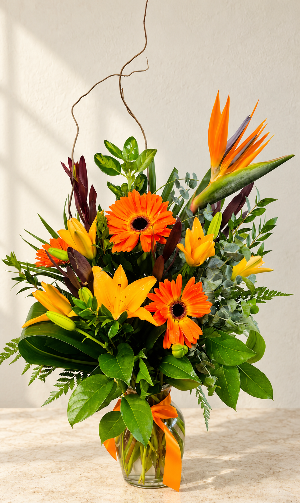 Bright tropical flower arrangement on stone countertop 1.png