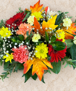 Overhead Oval Floral Arrangement on Warm Stone 1.png